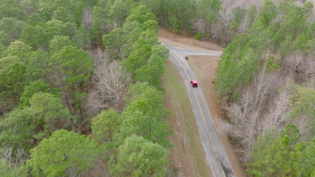 Aerial Footage of a Jeep Wrangler Turning a Rural Bend