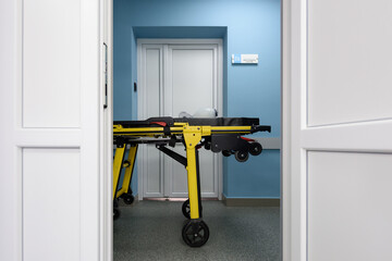 Emergency department in a hospital. Yellow ambulance medical stretcher with resuscitation bag for...