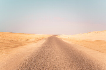Landscape view of dusty road going far away nowhere
