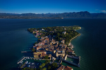 Italian castle on Lake Garda. Aerial panorama of Sirmione. Sirmione aerial view. Top view of the historic center of the Sirmione peninsula, lake garda. Lake Garda, Sirmione, Italy.