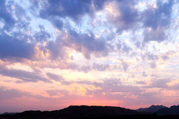 Colorful cloudy sky at sunset. Gradient color purple sky with clouds