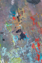 creative colored background: a temporary pattern of strokes and stains of fresh colored primer on...