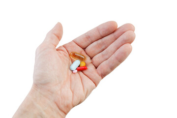 Closeup human hand with multicolored pills isolated on white.