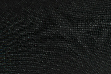 dark creative background: black primed linen canvas, uneven lighting, toning