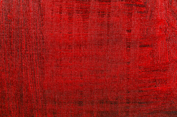 abstract creative background: red stain of colored primer when toning the canvas, temporary object.