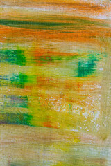 abstract rainbow multicolored background formed by erasing paints from the canvas, short focus. Not an art object, temporary effect.