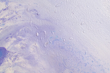 abstract creative background: oil paint frozen in a container after dilution, light color toning, short focus.