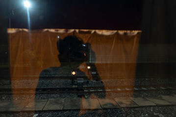 Obraz premium Reflection in the mirror from the train carriage
