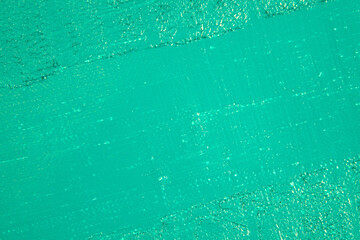 turquoise green abstract background, applied tinted primer on a white surface