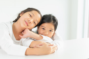 portrait of beautiful young children and cute little child smile, happy, look at camera with copy space. asian children study and learn in education classroom at small school