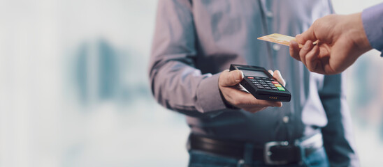Obraz na płótnie Canvas Customer paying with his credit card