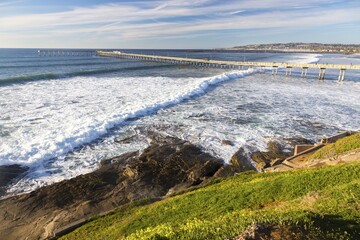 Ocean Beach Pier Aerial View and Southern California Pacific Coastline. Scenic San Diego Seascape on a Clear Sunny Winter Day
