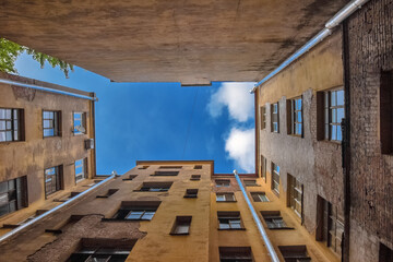 blue sky and well from houses in yard-well, st. Petersburg, Russia, Europe, bottom view, perspective