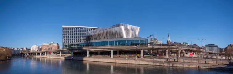 Foto op Canvas Panorama view over the canal Karlbergskanalen, apartment houses, hotels and the modern styled congress building Stockholm Waterfront embedded in traffic routes a sunny winter day in Stockholm © Hans Baath