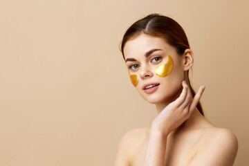 young woman skin care face patches bare shoulders hygiene close-up Lifestyle
