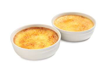 Delicious creme brulee in ceramic ramekins on white background