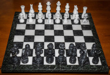 Chess pieces on chess board at start of game