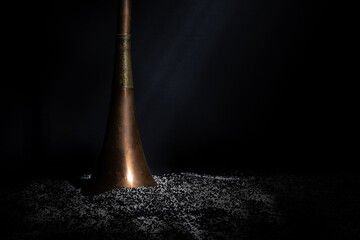 Obraz na płótnie Canvas black powder scattering from a tube
