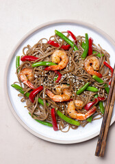 Soba noodles with shrimp, pepper and green beans. Japanese cuisine. Asian food.