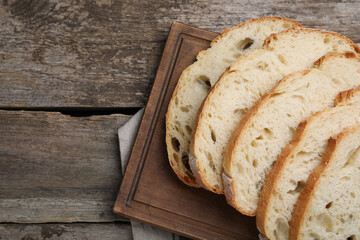 Freshly baked sodawater bread on wooden table, flat lay. Space for text