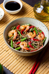 Soba noodles with shrimp, pepper and green beans. Japanese cuisine. Asian food.