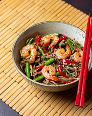 Soba noodles with shrimp, pepper and green beans. Japanese cuisine. Asian food.