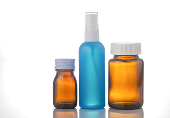 medicine bottle and pills on white background