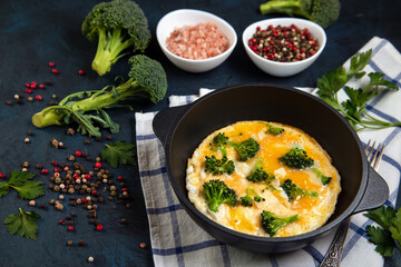 Frittata with broccoli, herbs and spices. Healthy food rich in protein and fiber.