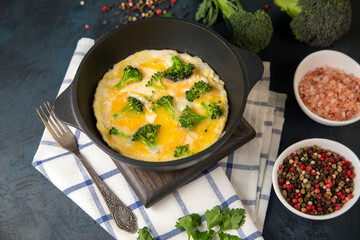 Frittata with broccoli, herbs and spices. Healthy food rich in protein and fiber.