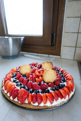 Tart with strawberry, raspberry, blueberry and whipped cream