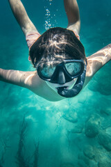 Close up of boy snorkelling undersea