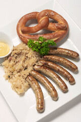 sausage with sauerkraut and pretzel traditional german food meal