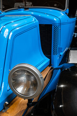 Headlight of the blue vintage car