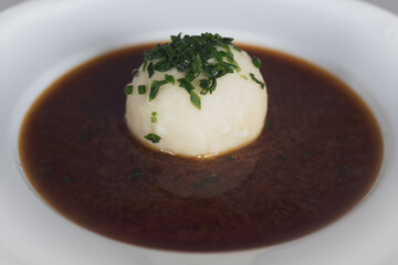 cooking at home and ready to eat, a greaves dumpling in brown sauce from roast venison and chives