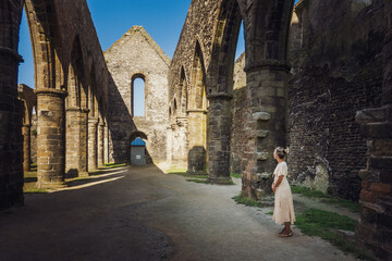 Woman at old ruined building