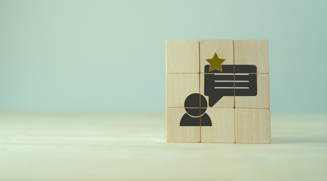 Customer experience, feedback, satisfation evaluation concept. Rank rating stars feedback. The wooden cubes with customer experience icon on grey background, copy space. Marketing banner support.