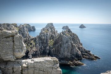 Scenic view of rocky cliff on sea