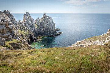 Scenic view of rocky cliff on sea