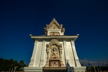 Background of religious sights in Surat Thani province of Thailand, Thung Sied Temple, a wooden church in the middle of the water in white tones built on a white boat-shaped base.