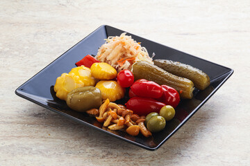 Plate with pickled vegetables and mushrooms