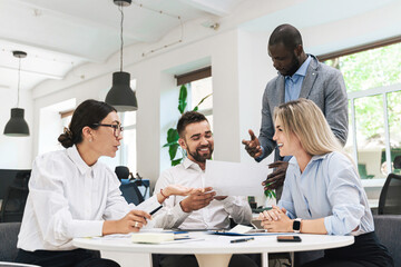 Multi-ethnic business people during meeting in modern office