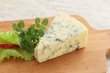 Blue cheese piece over board