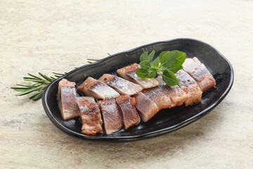 Delicous sliced herring fillet in grape sauce