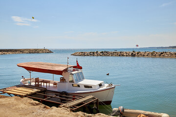 Boat in turkey on the shores of the Mediterranean sea, during the covid 19 pandemic