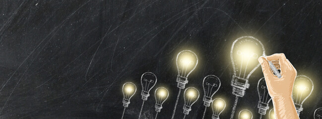 light bulb Chalk drawing on black chalkboard in Business design and copy space for text,
electric bulb lines art doodle style on black board for Business concept.