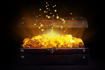 Open treasure chest with gold coins on table against black background