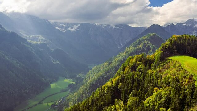 Logar Valley sun rays. View on cloudy October mountain valley from above. Logarska Dolina, Slovenia