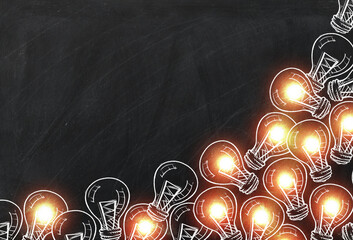 light bulb Chalk drawing on black chalkboard in Business design and copy space for text,
electric bulb lines art doodle style on black board for Business concept.