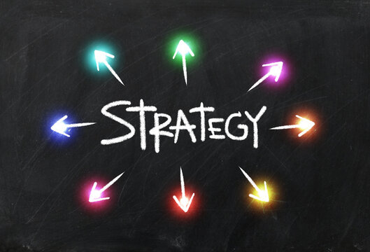 strategy concept with chalk drawing on black background illustration.