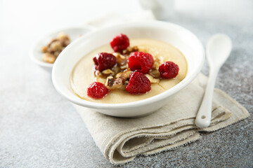 Homemade semolina pudding with raspberry and nuts